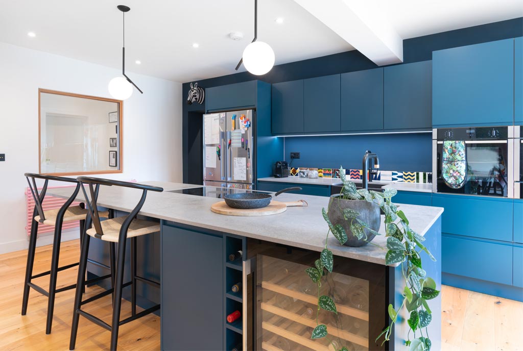 Feature image matt blue kitchen with patterened tile splash back joseph king interiors bristol