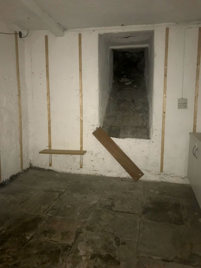 Basement room with old coal shoot