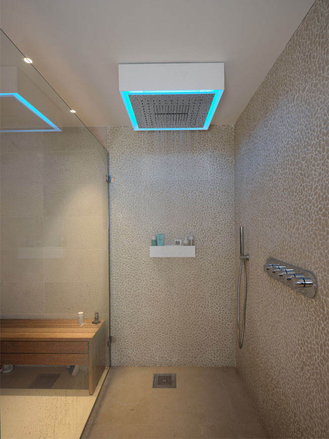 Home spa shower with pale blue LED light