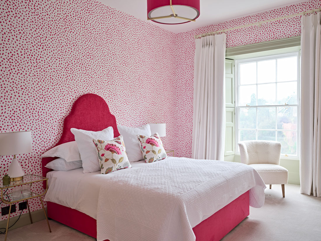 Pink-spotty-bedroom-with-pink scalloped headboard
