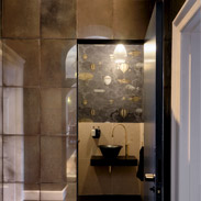 Feature image dark and moody concealed cloakroom behind mirrored door joseph king interiors bristol