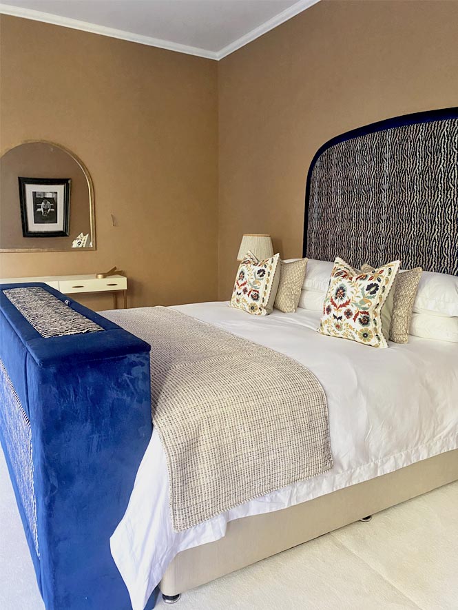 Tall blue misa headboard with gold walls master bedroom joseph king interiors bristol 2