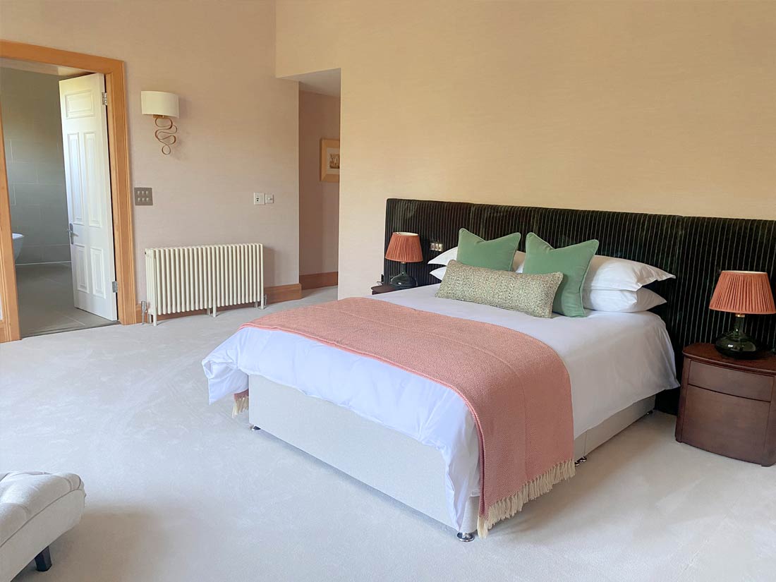 Pink and green bedroom wide headboard joseph king interiors bristol