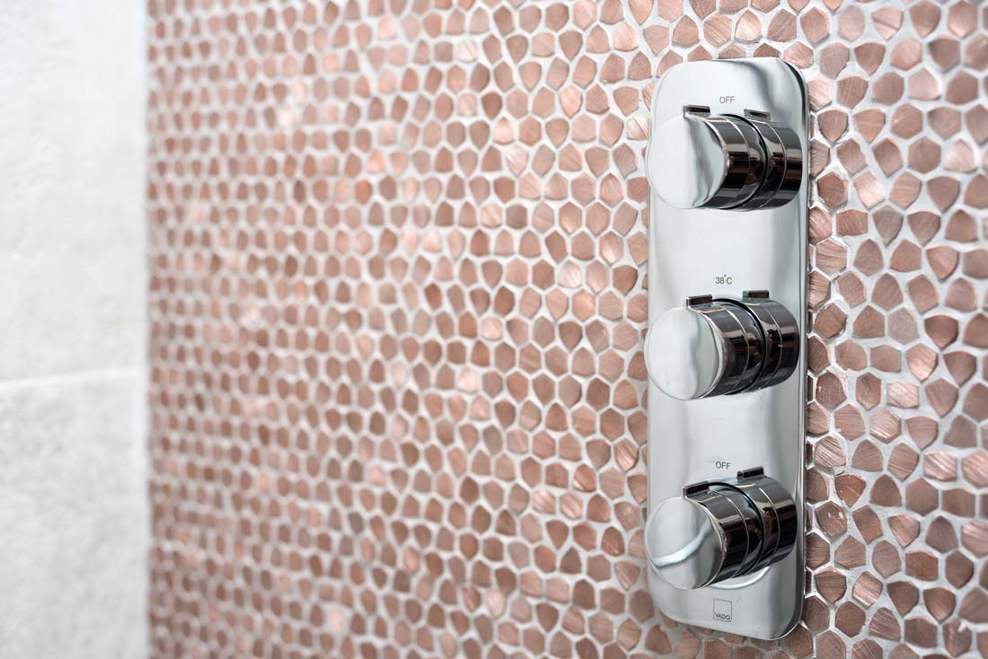 Porcelanosa-rose-gold-mosaic-tile-Joseph-King-Interiors-Bristol Porcelanosa rose gold mosaic tile with a shower control