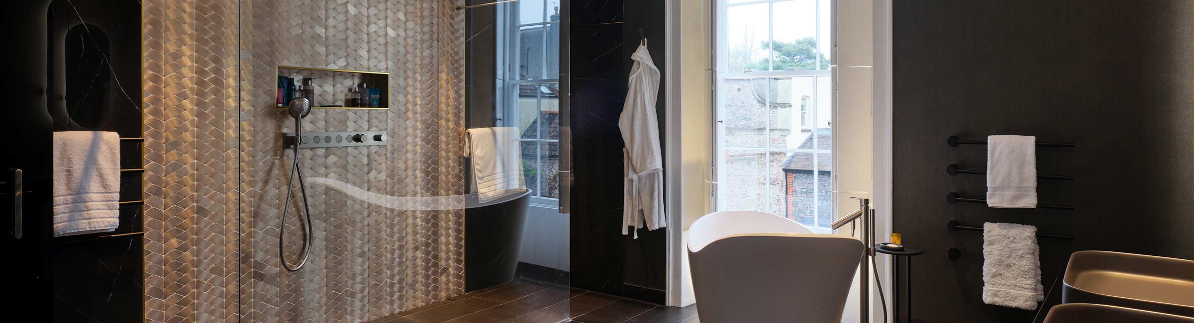 black-and-gold-luxury-bathroom-Joseph-King-Interiors-Bristol cut through image of a black and gold luxury bathroom
